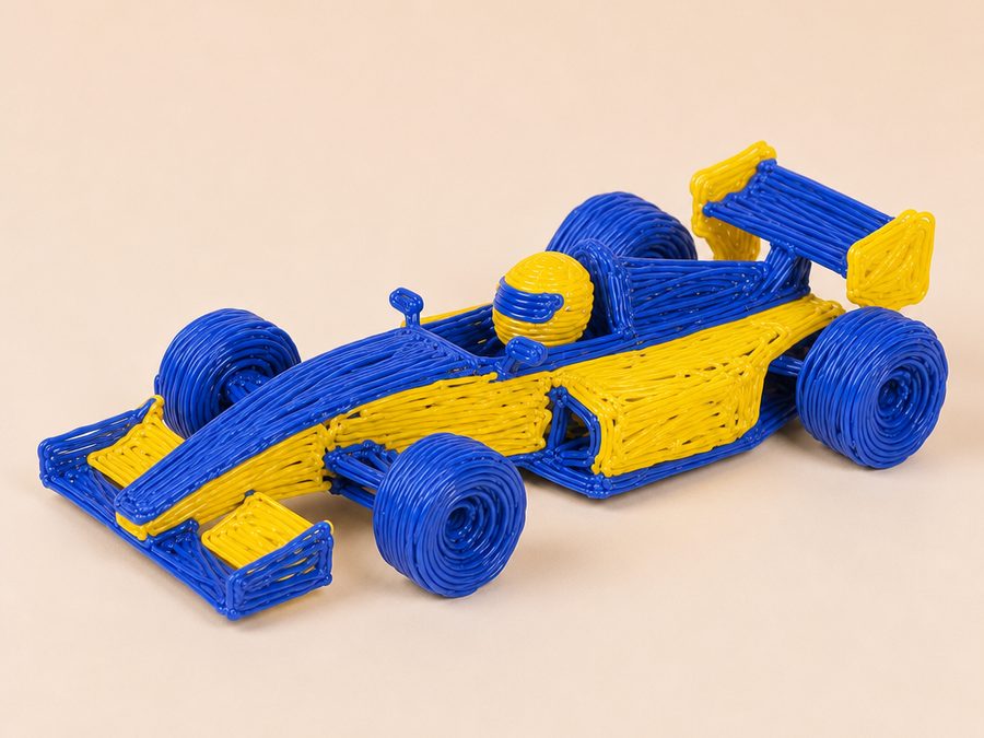 Un coche de Fórmula 1 azul y amarillo creado con filamento de bolígrafo 3D